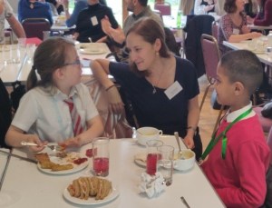 children talking to an adult